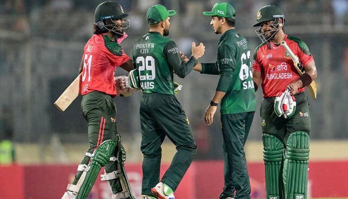 Bangladeshs Parvez Hossain Emon (right) and Jaker Ali (left) shake hands with Pakistans Mohammad Haris (second left) and Saim Ayub at the end of the first Twenty20 international cricket match between Bangladesh and Pakistan at the Sher-e-Bangla National Cricket Stadium in Dhaka on July 20, 2025. — AFP