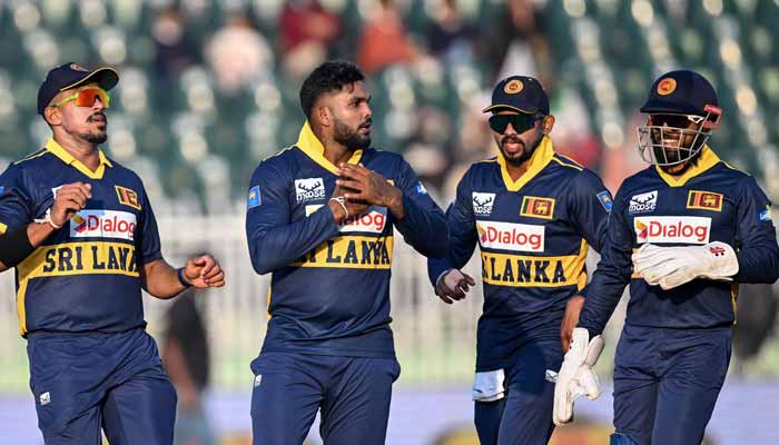 Sri Lankas Wanindu Hasaranga celebrates with teammates after taking the wicket of Pakistans Mohammad Rizwan during the first one-day international (ODI) cricket match at the Rawalpindi Cricket Stadium, Rawalpindi, November 11, 2025. — AFP