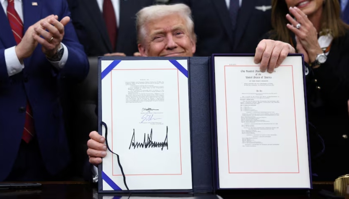 US President Donald Trump signs the funding bill to end the US government shutdown, at the White House in Washington, DC, US, November 12, 2025. — Reuters