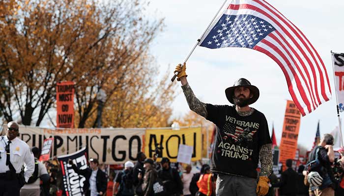 Anti-Trump demonstrators attend a protest to mark one year since the re-election of US President Donald Trump, in Washington, DC, US, November 5, 2025. — Reuters