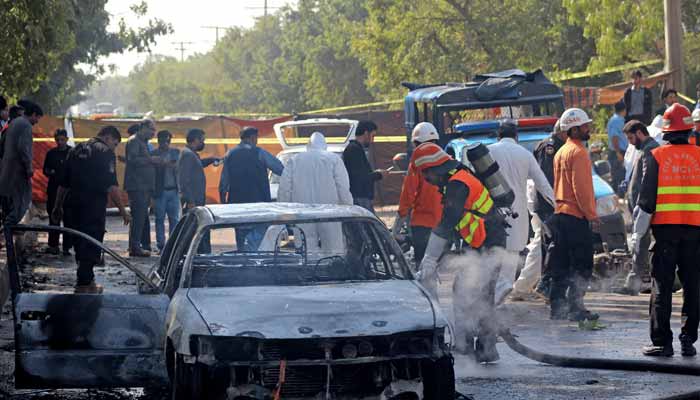 Firefighter douses a vehicle after a blast outside a court building in Islamabad on November 11, 2025. — Reuters
