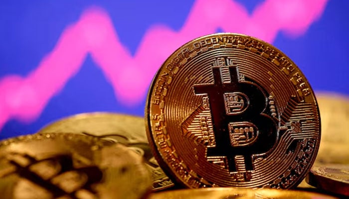 A representation of virtual currency Bitcoin is seen in front of a stock graph in this illustration taken January 8, 2021. — Reuters