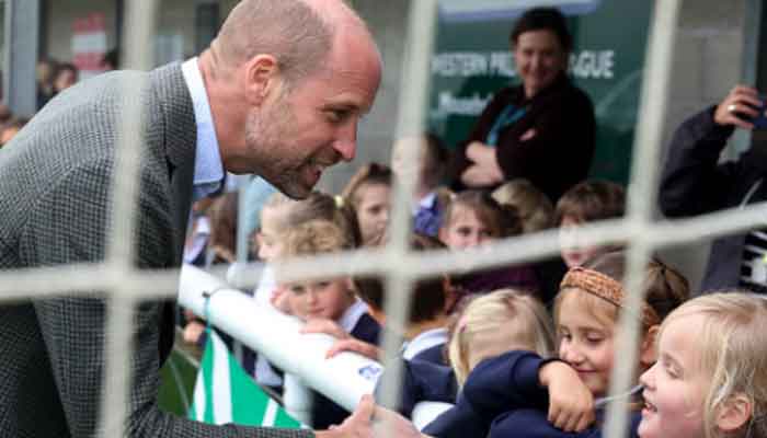 Prince William talking to children during his visit to Cornwall