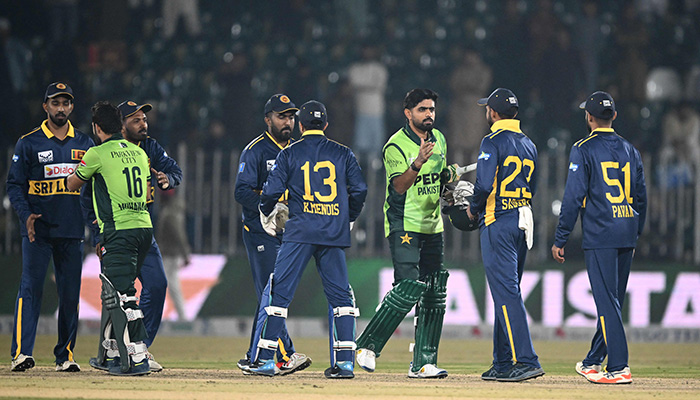 Pakistans Babar Azam (3rd R) and Mohammad Rizwan (3rd L) greet Sri Lankas cricketers after winning the second one-day international (ODI) cricket match between Pakistan and Sri Lanka at the Rawalpindi Cricket Stadium on November 14, 2025. — AFP
