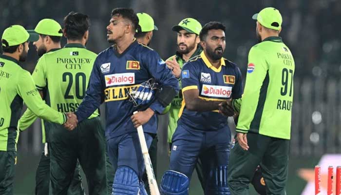Pakistan and Sri Lankan players shake hands after a match. — AFP/File