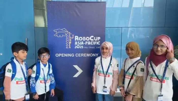 Pakistani students pose for a photo during the robotics competition in Abu Dhabi. — Reporter