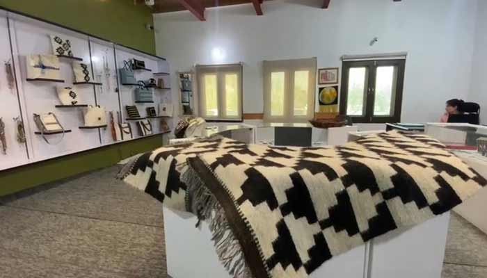 Sharma, Hunza’s traditional goat hair rug, is displayed alongside hand embroidered cultural pieces.— Reporter