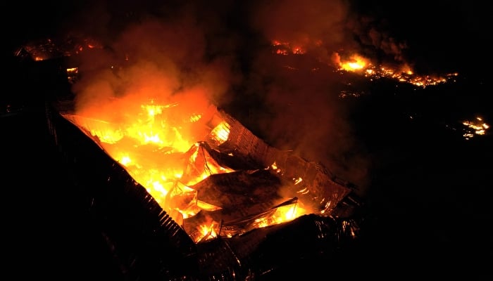 This aerial view shows a fire after an explosion in an industrial area of Ezeiza, Buenos Aires province, Argentina, on November 14, 2025. — AFP