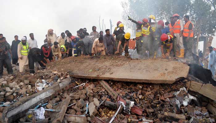 Rescue workers busy in searching and rescue work on collapsed a fireworks godown after an explosion occur at in Latifabad, Hyderabad on November 15, 2025. — INP