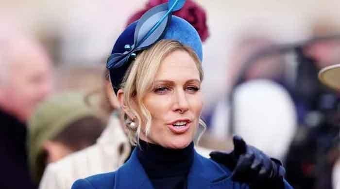 Storm Claudia leaves Zara Tindall struggling with her hat 