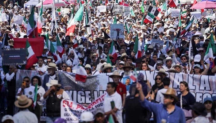 Demonstrators march to protest against insecurity and corruption in the country, in Mexico City, Mexico, November 15, 2025.— Reuters