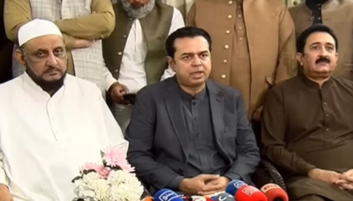 Minister of State for Interior Talal Chaudhry (centre) addresses the press conference in Faisalabad on November 16, 2025. — Screengrab via Geo News
