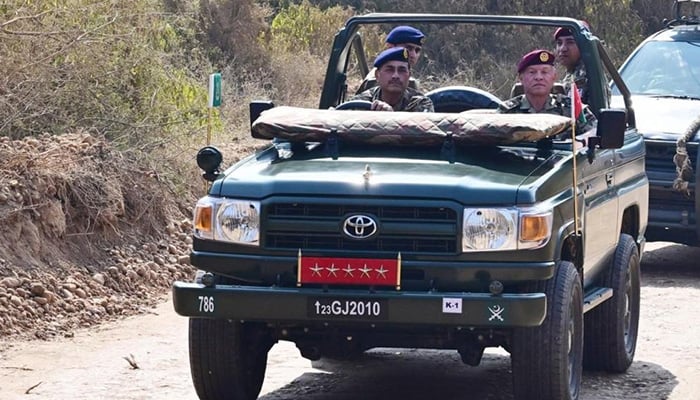 Field Marshal Asim Munir drives with Jordanian King Abdullah during his visit to Tilla Field Firing Ranges. — ISPR