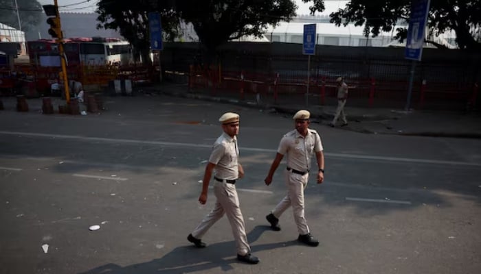 Police officers patrol near the site of Mondays deadly car blast, in front of the historic Red Fort in the old quarters of Delhi, India, November 12, 2025. — Reuters
