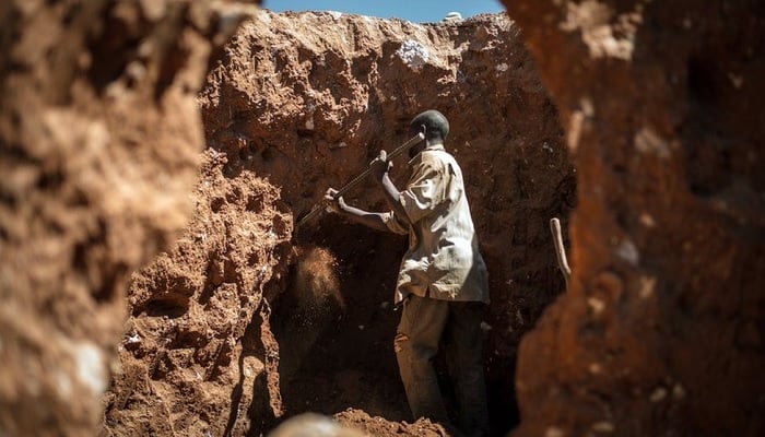 An Artisanal miner works at Tilwizembe, a former industrial copper-cobalt mine, outside of Kolwezi, capital city of Lualaba Province in the south of the Democratic Republic of the Congo, June 11, 2016. — Reuters