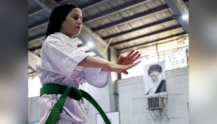 An Iranian girl pictured during a karate match. — AFP