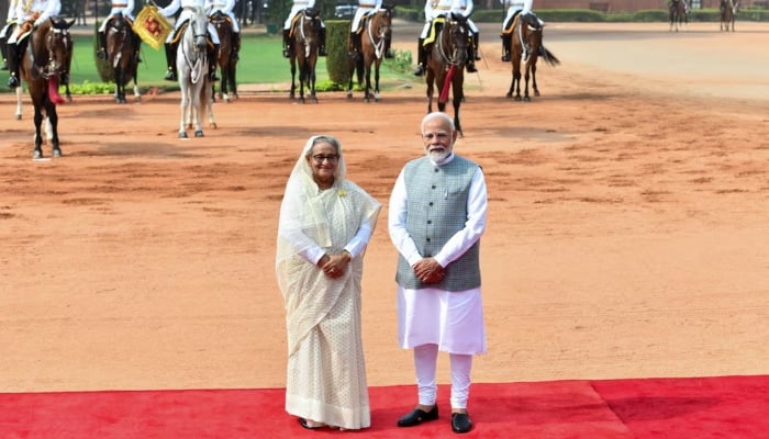 Bangladeshs then-Prime Minister Sheikh Hasina along with Indias Prime Minister Narendra Modi pose for a picture during her ceremonial reception at the Forecourt of Indias Rashtrapati Bhavan Presidential Palace in New Delhi, India, June 22, 2024. — Reuters