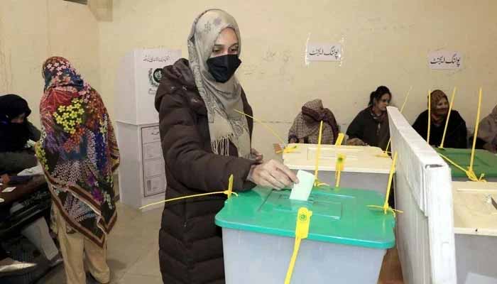A female voter casts her vote at a polling station during general elections 2024, in Lahore on Thursday, February 8, 2024. — PPI