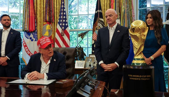 US President Donald Trump makes an announcement, while US Vice President JD Vance looks on, as FIFA president Gianni Infantino and US Homeland Security Secretary Kristi Noem stand behind the FIFA World Cup Trophy, in the Oval Office at the White House in Washington, DC, US, August 22, 2025. — Reuters