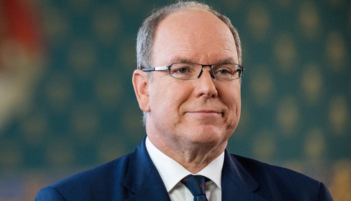 Prince Albert II distributes a medal to Princess Stéphanie