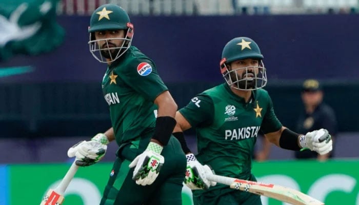 Babar Azam and Mohammad Rizwan run between the wickets during the ICC mens Twenty20 World Cup 2024 match between Pakistan and Canada at Nassau County International Cricket Stadium in East Meadow, New York on June 11, 2024. — AFP