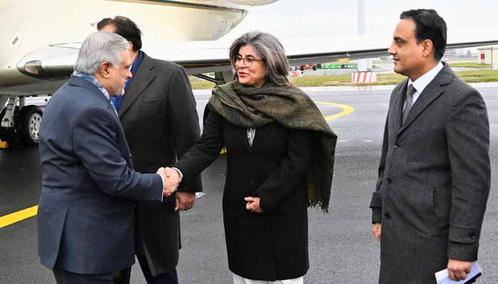 Deputy Prime Minister and Foreign Minister Ishaq Dar (left) shakes hand with Foreign Secretary Amna Baloch (centre right) after arriving at Brussels, Belgium, November 19, 2025. — X/@ForeignOfficePK