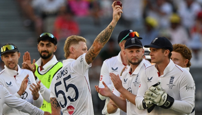 Englands Ben Stokes (C) celebrates his five wickets with teammates on day 1 of the first Ashes cricket Test match between Australia and England at Perth Stadium in Perth on November 21, 2025. — AFP