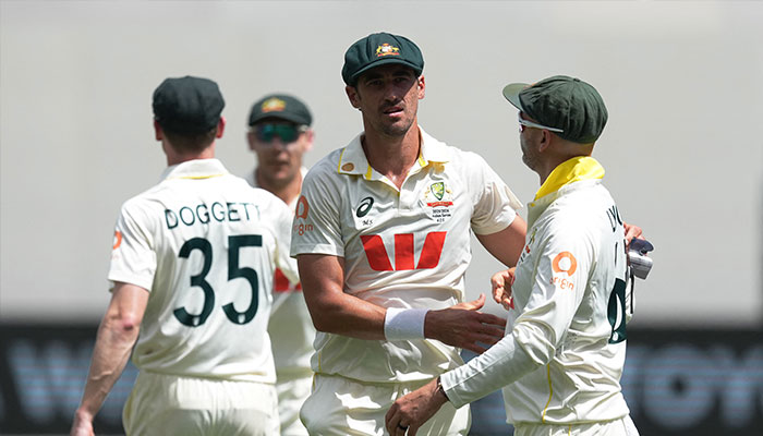 Australias Mitchell Starc celebrates with Nathan Lyon after his seven wicket haul following the wicket of Englands Mark Wood to end the innings, caught out by Alex Carey at Perth Stadium, Perth, Australia, on November 21, 2025. — Reuters