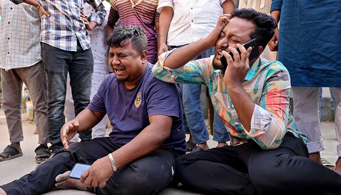 Men mourn the death of their relatives outside a hospital morgue following an earthquake in Dhaka, Bangladesh, November 21, 2025. — Reuters