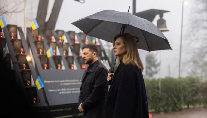 Ukraines President Volodymyr Zelenskiy and his wife Olena attend a commemoration ceremony in Kyiv, Ukraine, November 21, 2025. — Reuters