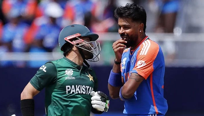 Pakistans Mohammad Rizwan (left) and Indias Hardik Pandya interact during their ICC Mens T20 World Cup match at the Nassau County International Cricket Stadium in New York on June 9, 2024. — ICC