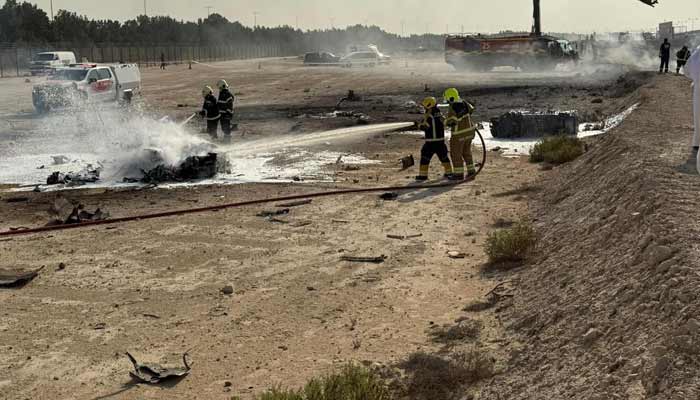 Firefighters carry out a rescue operation after Indian jet, Tejas, crashed during the Dubai Airshow on November 21, 2025. — Reporter
