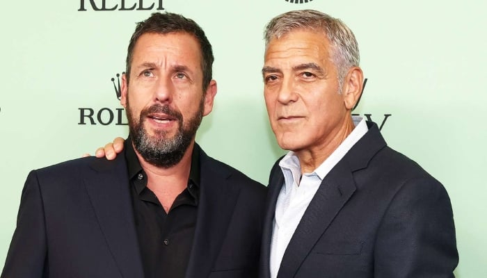 Photo: Adam Sandler what it is like to walk beside George Clooney