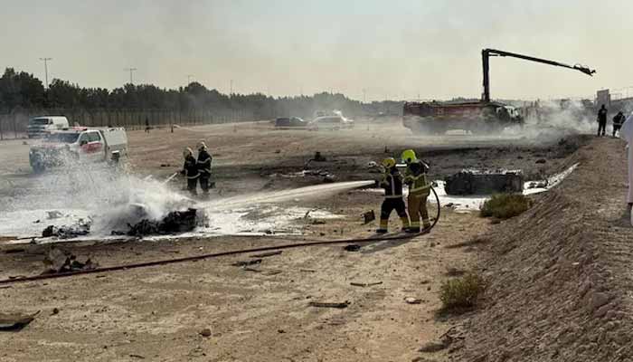 Firefighters work at the site of a crash involving an Indian-made HAL Tejas fighter jet at the Dubai Air Show, United Arab Emirates, November 21, 2025, in this handout picture obtained from social media. — Reuters