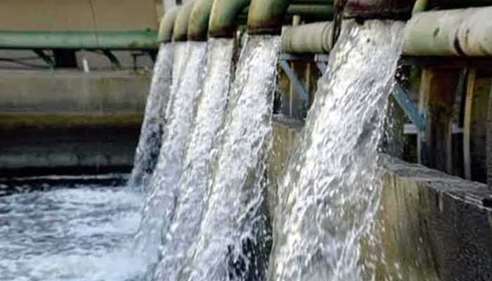The image shows water flowing from a water pumping station. — APP/File
