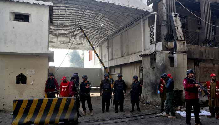 Paramilitary soldiers stand guard at the site after suicide bombers targeted the headquarters of the Federal Constabulary in Peshawar on November 24, 2025. — Reuters