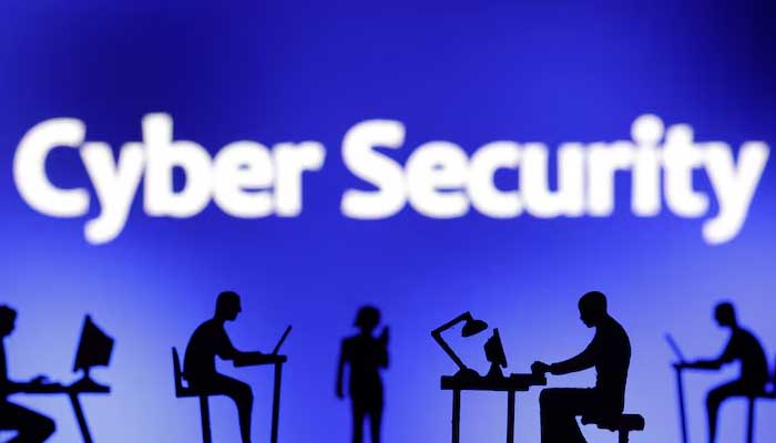 Figurines with computers and smartphones are seen in front of the words Cyber Security in this illustration taken, February 19, 2024. — Reuters