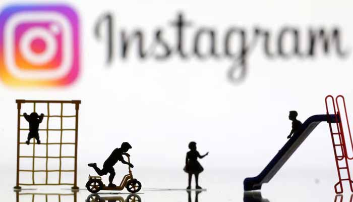 Children playground miniatures are seen in front of displayed Instagram logo in this illustration taken April 4, 2023. — Reuters