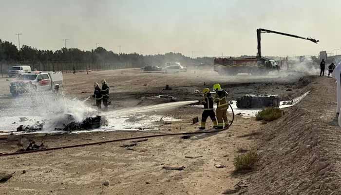 Firefighters work at the site of a crash involving an Indian-made HAL Tejas fighter jet at the Dubai Air Show, United Arab Emirates, November 21, 2025. — Reuters