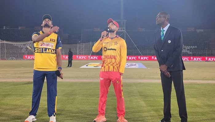 Sri Lanka captain Dasun Shanaka (left) flips the coin as Zimbabwes Sikandar Raza (centre) makes the call at the toss for their T20I tri-series match at the Rawalpindi Cricket Stadium in Rawalpindi on November 25, 2025. — PCB