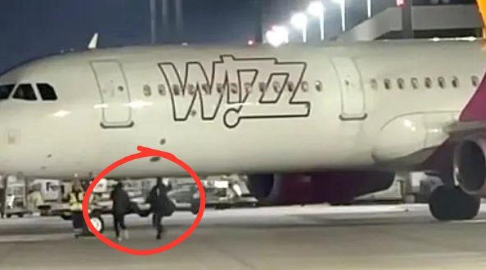 Two passengers force emergency exit to chase missed flight on runway in Germany: Watch
