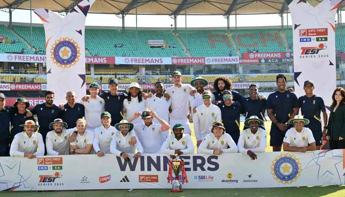 South Africa´s players pose with the trophy to celebrate their win in the end of the fifth day on November 26, 2025. — AFP