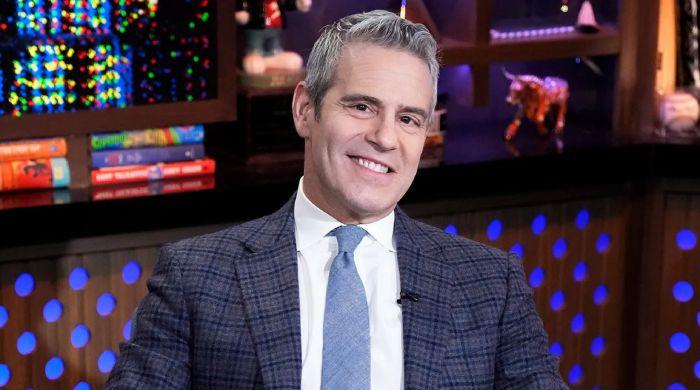 Andy Cohen flexes 'gorgeous feet' on live television