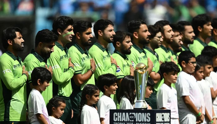 Pakistan squad sings national anthem during a Champions Trophy match. — ICC