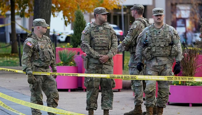 National Guard members stand in a cordoned-off area after two National Guard members were reportedly shot near the White House in Washington, DC, US, November 26, 2025. — Reuters