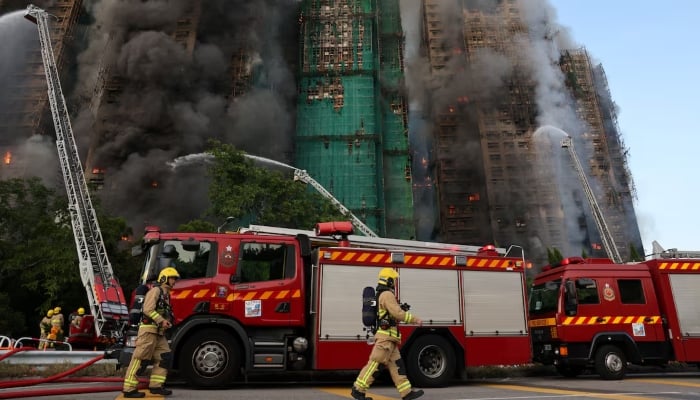 Firefighters work as efforts are underway to extinguish flames engulfing bamboo scaffolding across multiple buildings at the Wang Fuk Court housing estate in Tai Po, Hong Kong, China, November 26, 2025. — Reuters