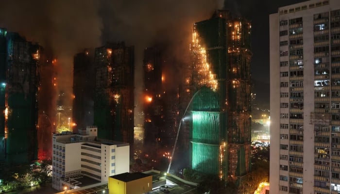 Firefighters work to extinguish flames as bamboo scaffolding burns across multiple buildings at Wang Fuk Court housing estate in Tai Po, Hong Kong, China, November 26. — Reuters