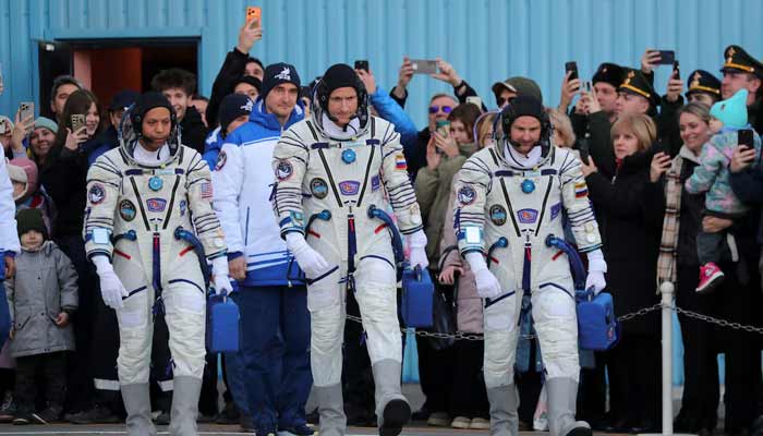 Nasa astronaut Chris Williams, Roscosmos cosmonauts Sergey Kud-Sverchkov and Sergey Mikaev walk before departure to the launch pad at the Baikonur Cosmodrome, Kazakhstan, November 27, 2025.— Reuters