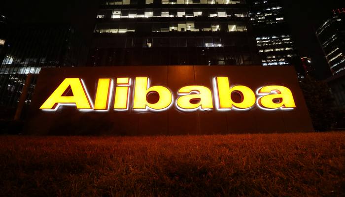 The logo of Alibaba Group is lit up at its office building in Beijing, China August 9, 2021. — Reuters