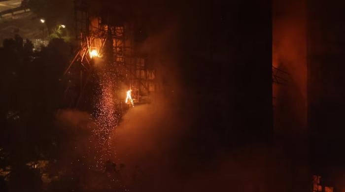 Hong Kong fire kills 55, hundreds missing as police blame construction firm